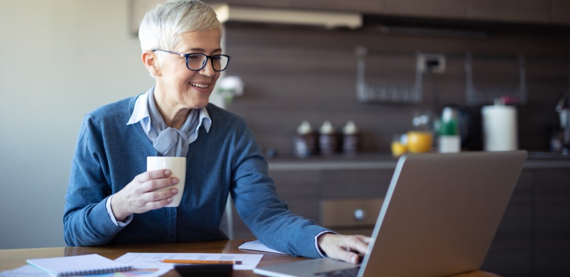 retired-woman-investing-laptop-401k-ira.jpg