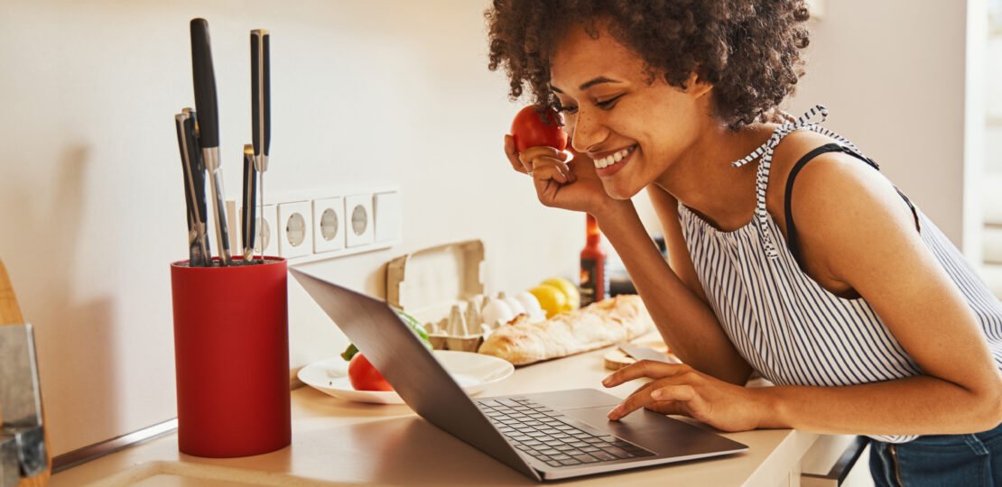 a-person-staring-at-their-laptop-with-excitement-after-buying-an-insurance-policy-online.jpg
