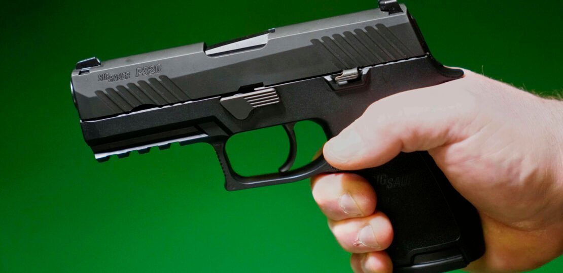 sig-sauer-gun-ap-photo-scaled.jpg