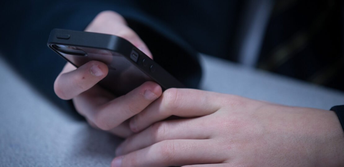 child-online-safety-cellphone-Bloomberg-scaled.jpg