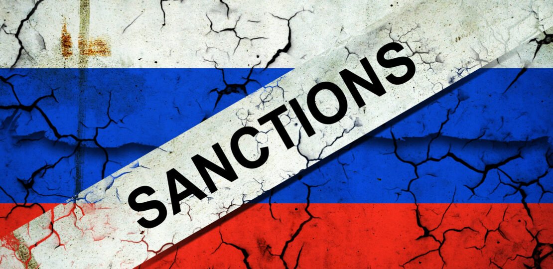 cracked-flag-of-russia-with-sanctions-450422969-bigstock-scaled.jpg