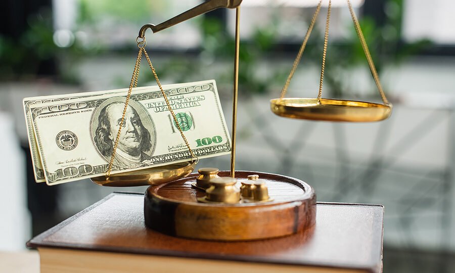 bigstock-litigation-finance-justice-scales-dollars-money-funding-440952614.jpg